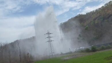 कैमरे के लेंस से In Mhow, water shot up even higher than the high-tension line tower after a pipeline burst.